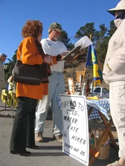 JUST SAY NO : Cambria volunteers Tess Wright (left) and Hilah Danell (right) are making it easier for residents such as Steve Brant (center) to navigate a confusing protest process for new water and sewer rates under Proposition 218. - PHOTO BY KATHY JOHNSTON