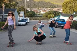 ROLLIN WITH THE SISTERS : Surf Sisters (left to right) Jennifer Jozwiak, Deby Hansen (crouching), Christy Serpa (background), Colleen Gnos, and Jennifer Blonder want to show you movies for the good of the ocean. - PHOTO BY JESSE ACOSTA
