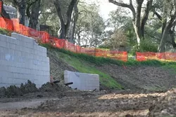 BULLDOZER MADNESS: Neighbors at the top of this Atascadero hill were never notified that the wooded gentle slope near their homes would be converted into a steep, erosion-prone drop-off. - PHOTO BY CHRISTOPHER GARDNER