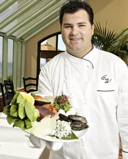 ON THE CLIFFS : Chef Gregg Wangard creates delicious dishes at Marisol at the Cliffs Resort. He's pictured here with Manila clams, Spanish chorizo, big-eye tuna, sunflower sprouts, Meyer lemon, Fuji apple, and more. - PHOTO BY STEVE E. MILLER