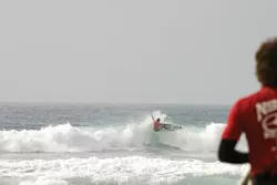 DOING THE BEST HE CAN : Cal Poly junior Scott Cole makes the most of the sloppy conditions at the Mustangs' first competition of the year at Black's Beach in La Jolla. - PHOTO COURTESY OF NICK MESTRE