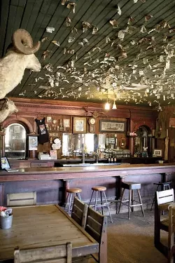 RUSTIC CHARM : Little has changed about the Pozo Saloon since it was constructed nearly 150 years ago. The interior is decorated with period artifacts, including a little pistol that the owners found while tilling the back field. - PHOTO BY STEVE E. MILLER