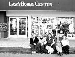 OUT LAW'S :  Longtime employees and owners of Law's Hobby Center, who collectively have worked at the craft store for more than 75 years, sat outside the closing business on Jan. 30. Pictured, from left to right, is Charlene Maddox, owner Bobbie Vasquez, DiAnn Williams, owner Christine Ahern, and owner Sharon Gove. - PHOTO BY STEVE E. MILLER