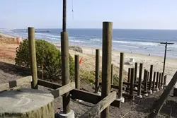 STAIRWAY TO OCEAN: : A sturdy new staircase will replace the rickety old one that provided ocean access from Pismo Beach's Wilmar Street. - PHOTO BY STEVE E. MILLER