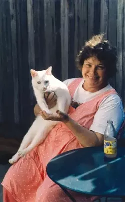 CAT LOVER: Sharon visiting with family members in Northern California. - PHOTO COURTESY OF THE OSTMAN FAMILY