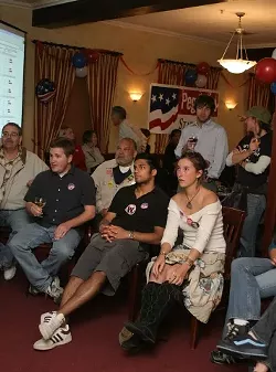 SHOCK AND AWE : While Republicans at parties around the county were celebrating, Democrats — like these gathered at Peg Pinard’s election night bash — quietly watched as several of their favorite candidates lost. - CHRISTOPHER GARDNER