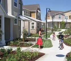A HOME OF THEIR OWN : San Luis Obispo's inclusionary housing ordinance allowed the Douglas family Jaclyn, 26 Walker, 5 Spencer, 6 and (not pictured) Jeremy, 29 to buy a three-bedroom home in mid-August in a new Centex development on Broad Street. - PHOTO BY KATHY JOHNSTON
