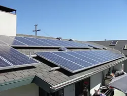 POWER TO THE PEOPLE: Jeff Oldham of Los Osos powers his home, workshop, Jacuzzi, and more with this 30-panel, 5-kilowatt solar power system, and still has enough energy left over to plug in his neighbors Christmas lights.