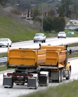 FOLLOW THAT TRUCK : Enforcement officials ask anyone who suspects illegal dumping near a creek to call CalTips at 1-888-334-2258. - PHOTOS BY CHRISTOPHER GARDNER