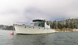 SEIZE THE BAY: A Fish and Game warden used this boat as an example of why illegally moored vessels in Windy Cove create an environmental hazard: This boat, he said, needs to have leaking seawater pumped out once a week, or it could sink, creating major a fuel spill. - CHRISTOPHER GARDNER
