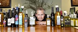 OIL THE POSSIBILITIES : We Olive owner Ray Russell offers featured oils from California and around the world. - PHOTO BY STEVE E. MILLER
