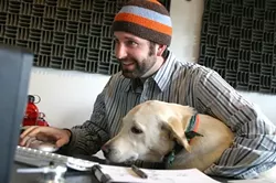 A BOY AND HIS DOG : Todd Peterson and dog Soda Pop head Red Canary Productions, a company that specializes in bringing unique, broadcast-quality media to the web. - PHOTO BY CHRISTOPHER GARDNER