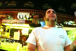 INTO THAT GREEN NIGHT :  McCarthy&acirc;&euro;&trade;s bar manager Colin Wenzl serves up the amber wisdom. - PHOTO BY CHRISTOPHER GARDNER