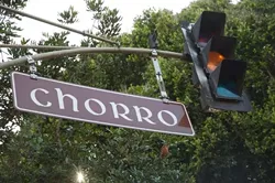 WHAT DOES IT MEAN? : Regulations dictate that street signs must be easy to pronounce and come with literal and common-use definitions. How is your Spanish? It may not be against any laws, but "chorro" is a term for an indelicate sort of intestinal distress. - PHOTO BY JESSE ACOSTA