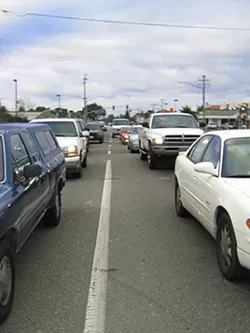 TIRED OF WAITING : Traffic piles up daily on Nipomos West Tefft Street, as commuters wait to enter Highway 101, but congestion may clear if the San Luis Obispo County Board of Supervisors approves the neighborhoods new design plan. - PHOTO BY JEANINE STEWART