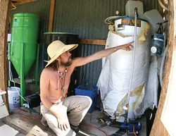 DO IT YOURSELF: From right to left: Jason Hoar explains the path vegetable oil takes through the biodiesel refining process; oil from local restaurants ready for processing; - CHRISTOPHER GARDNER