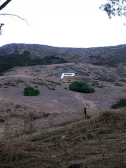 THE WRITING ON THE HILL : The Cal Poly "P" has been made to spell many words throughout the years. You are probably not the first person to think of whatever you are thinking of making it say. - PHOTO BY RYAN MILLER