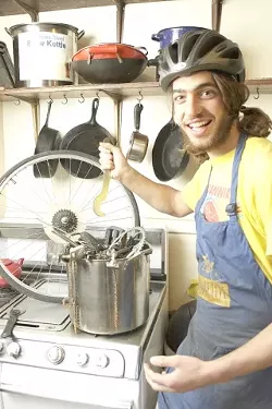 WHAT'S COOKING?: Brant Haflich, one of four "sous chefs" for the SLO Bike Kitchen, is cooking up some fun with parts. - PHOTO BY STEVE E. MILLER