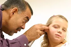 CAN YOU HEAR ME NOW?: Members on the Childrens Health Initiative board of directors describe Dr. Rene Bravo, a local pediatrician and president of the board, as a key element in building Healthy Kids - one who was able to bring a "pediatric view" from around the county to the program. - CHRISTOPHER GARDNER