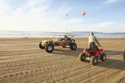 EARLY WARNING SYSTEM : Rob Hunter (left), a State Parks volunteer, patrols the dunes, warning people to be cautious. If they're doing something that might attract the attention of rangers, he lets them know. - PHOTO BY STEVE E. MILLER