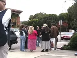 TWO GROUPS : Demonstrators regularly gather outside of San Luis Obispos Planned Parenthood office, which prompts volunteers (such as the one in the black vest at left) to escort women seeking abortions in and out of the building. - PHOTO CONTRIBUTED