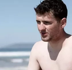 Lance Cpl. Travis Dodson reflects on his first-ever surf session. - PHOTO BY STEVE E. MILLER