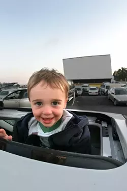 MAKING MEMORIES: Young Owen, Amy and Garth Turners almost-2-year-old son, had been to the drive-in before, but this would probably be "the first time he will remember it," said Garth. - CHRISTOPHER GARDNER