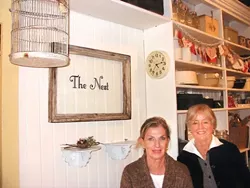 COLLECTORS : Pam McKiernan (left) and Judy Mora (right) opened their retro houseware and gift shop The Nest in the historic Ah Louis building. Their specialty is "repurposing" vintage items into modern de cor. - PHOTO BY KYLIE MENDONCA