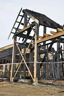 REMAINS: An Nipomo house fire on April 5 destroyed an unfinished structure intended for farmworker housing under H-2A, a government program for temporary foreign farmworkers. - PHOTO BY CAMILLIA LANHAM