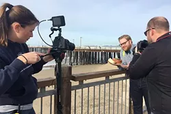 TANTALIZING VIDEOS: Dream Eater Chase Ramsey enjoys some Splash Café clam chowder by the Pismo Beach Pier during a California Dream Eaters shoot. Juice Media, a Paso-based production company, produces the web series that uses Instagram comments to seek out California’s best food and drink. - PHOTO COURTESY OF JUICE MEDIA