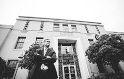 EMBATTLED:  Pismo Beach City Councilmember Erik Howell stands in front of the San Luis Obispo County Courthouse after being appointed to the California Coastal Commission by Gov. Jerry Brown in February 2014. Howell is the subject of a California Fair Political Practices Commission complaint filed by Pismo Beach residents. - FILE PHOTO BY HENRY BRUINGTON