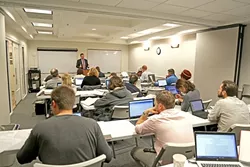 LAW AND ORDER: Stephen Wagner, a local attorney who teaches at the SLO College of Law, walks students through the nuances of criminal procedure. - PHOTO BY DYLAN HONEA-BAUMANN
