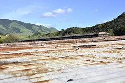 FUTURE WATER: SLO city biologist Freddy Otte has plans to turn the roof of this old reservoir off Fox Hollow Road into a cistern to help augment the flow of water in San Luis Obispo Creek. - PHOTO BY CAMILLIA LANHAM