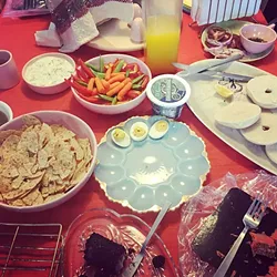 BLESS THIS MESS : Picking at the food all day long has become a Broncos and Brunch tradition. Go Broncos! - PHOTO BY HAYLEY THOMAS
