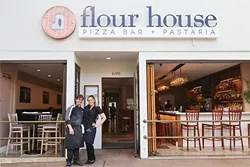 AMERICAN DREAM: Flour House Owners Alberto and Gessica Russo take a break from making pasta and pizzas at their new restaurant, which celebrated its grand opening late last month. - PHOTO BY DYLAN HONEA-BAUMANN