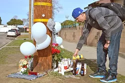 IN MEMORIAM: Matt James, 24, pays his respects to Javier Murillo-Sanchez and Aaron Sanchez-Hernandez, 23-year-old cousins killed in Santa Maria on their way home from an Alcoholics Anonymous meeting on Jan. 13. - PHOTO BY DAVID MINSKY