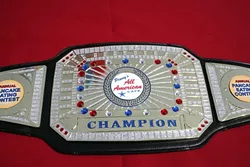 THE BIG BELT! : Sorry, champ. You can’t take the belt with you. It remains with your photo on the wall of Penny’s All American Café. - PHOTO BY GLEN STARKEY