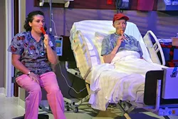 WE WAKE ETERNALLY: In a quiet moment of compassion, Vivian Bearing (Megan C.C. Walker)enjoys a Popsicle with her nurse Susie Monahan (Kerry DiMaggio), one of the only people at the hospital who treats her like a human and not just research. - PHOTO COURTESY OF JAMIE FOSTER PHOTOGRAPHY