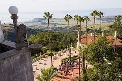 THE HEARST KINGDOM: A balcony at Casa Grande overlooks the castle and a breathtaking view of San Simeon. - PHOTO BY JAYSON MELLOM