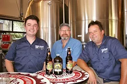 TIME TO TAP IT: From left, Tap It Brewing Company Events and Marketing Manager Mike Fogarty, Corporate Controller Matt Dolman, and Head Brewer Ryan Aikens are hosting a SLO Beer Week warm-up event and afterparty this week. - PHOTO BY HAYLEY THOMAS