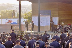 FIRE SEASON:  Hundreds of firefighters attend an Aug. 17 Chimney Fire briefing at the Paso Robles Mid-State Fairgrounds. The fire has burned 7,300 acres south of Lake Nacimiento with 25 percent containment as of press time. - PHOTO BY PETER JOHNSON