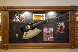 FEEL THE MUSIC: A guitar once owned and signed by Gene Simmons of KISS hangs on the wall at Gary Kramer Guitar Cellars in Paso Robles. - PHOTO BY JAYSON MELLOM