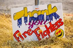 MANY THANKS: The community shows its gratitude to firefighters working the Chimney Fire with a sign along Nacimiento Lake Road. - PHOTO BY JAYSON MELLOM