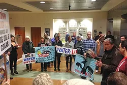 OIL AND WATER: Northern Chumash Tribal Council spokesman Fred Collins rallies supporters of a Chumash Heritage Marine Sanctuary in the lobby of the SLO County government building prior to the Board of Supervisors’ 3-2 vote passing a resolution in opposition of the sanctuary. - PHOTO BY PETER JOHNSON