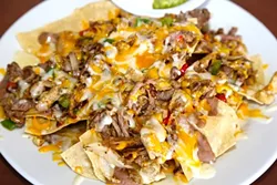 SAVE THEM!: It’s hard to finish a big plate of nachos, but save some for later. A toaster oven will re-crisp up the chips and re-melt that cheese. Just remember to get the guac on the side; nobody likes hot, brown avocado. - FILE PHOTO BY DYLAN HONEA-BAUMANN