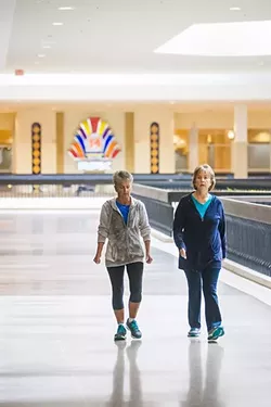 INDOOR ACTIVITY: Linda Schnell (left) and Shirin Reed (right) walk the wings of the Santa Maria Town Center together regularly, where they can enjoy an active trek free from the elements. - PHOTO BY JAYSON MELLOM