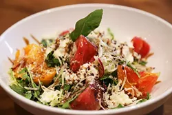 DELISH: Heirloom tomato and burrata with house balsamic reduction adds a clean, fresh seasonal note to SLO Brew’s comforting offerings. - PHOTO BY DYLAN HONEA-BAUMANN
