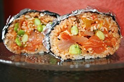 FISH, FOILED:  Poke Chef&rsquo;s sushi burrito is a flavor explosion of salmon, albacore, cucumber, edamame, green and red onion, cilantro, crab salad, kimchi, mango, avocado, crispy onion, and garlic, with a mix of their tangy bomber and lemon ginger sauces. - PHOTO BY HAYLEY THOMAS