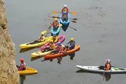 GUIDED TOUR: A group of kayakers is given instruction about the dos and don’ts of entering the caves in the waters below the park. - PHOTO BY GLEN STARKEY