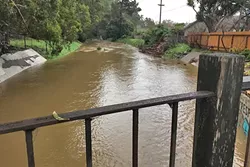 BEACH BOUND: For the first time in more than six years, Laguna Lake is full enough to outflow excess water to San Luis Obispo Creek and on to the Pacific. - PHOTO BY GLEN STARKEY